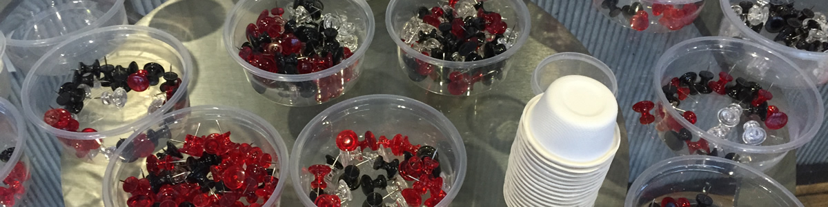 Glass dishes filled with push pins