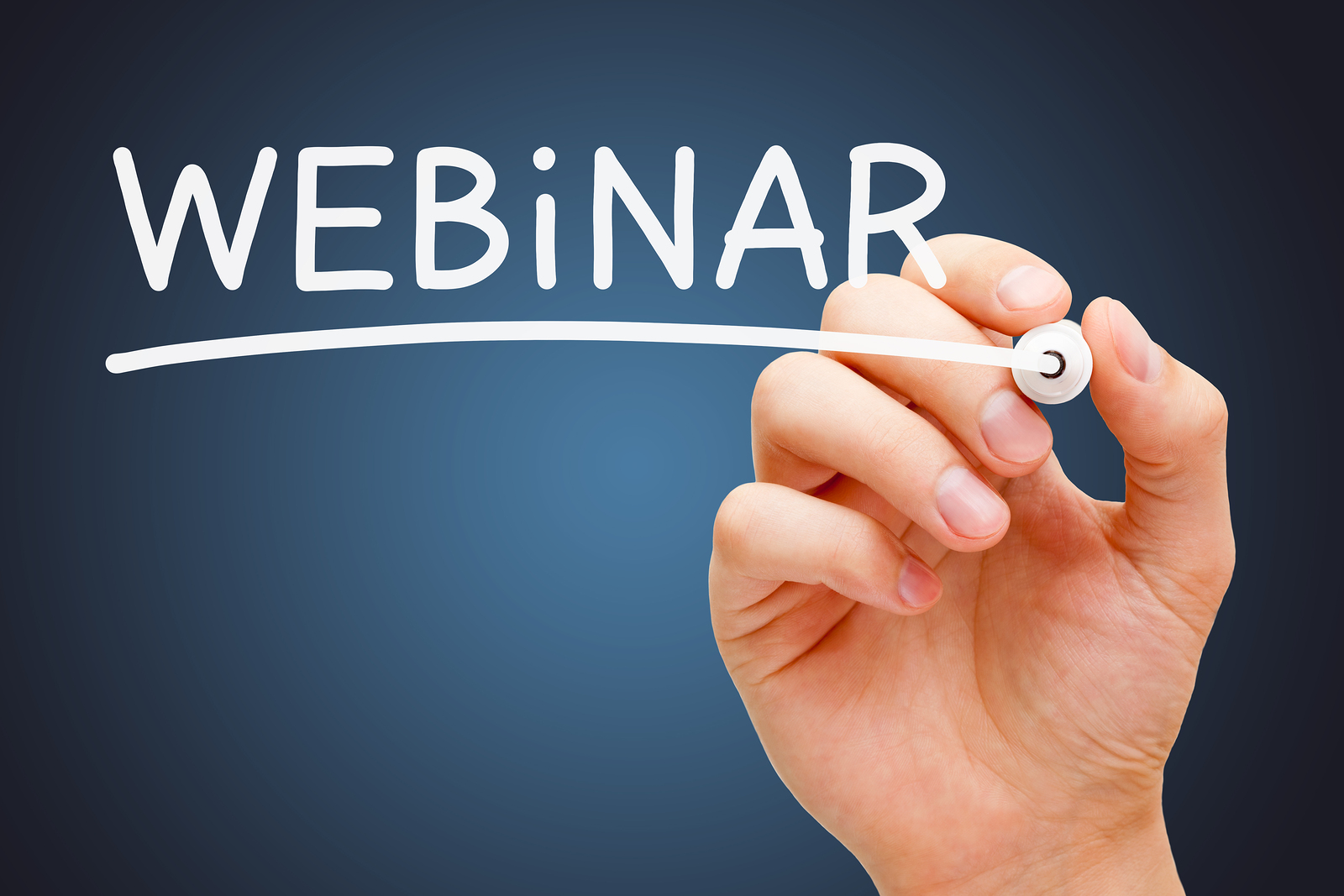 Hand writing the word Webinar and underlining it in white