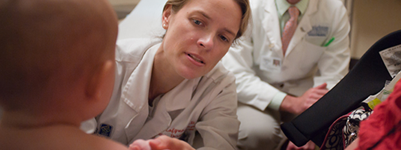 A doctor seeing a pediatric patient.
