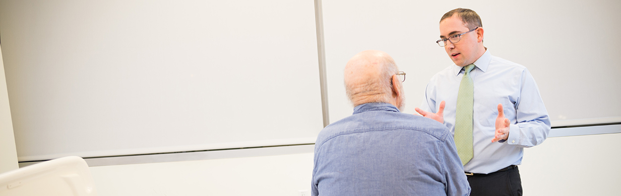 Dr. Kenneth Gundle speaking with a patient