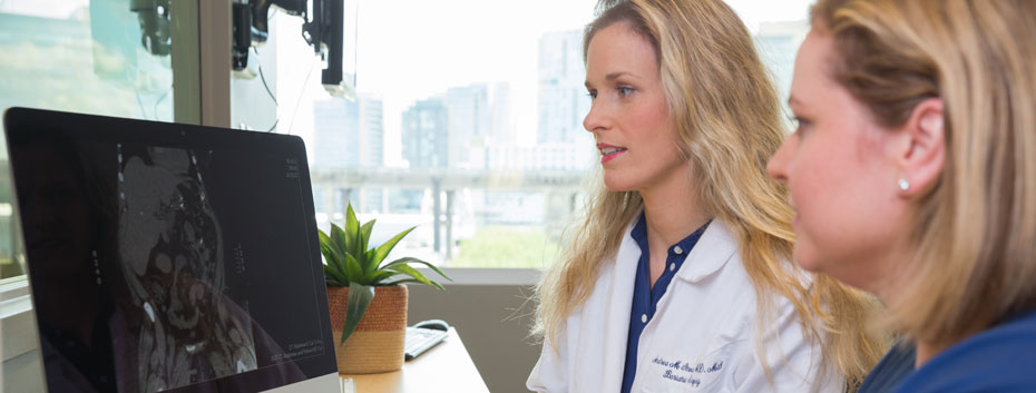Dr. Stroud and Stefanie Collier consult in the office