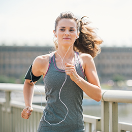 Runner on Bridge with Headphones