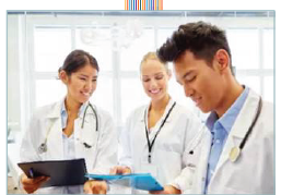 Students working in clinic looking over charts