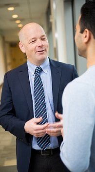 An OHSU cardiovascular specialist sharing information with a patient