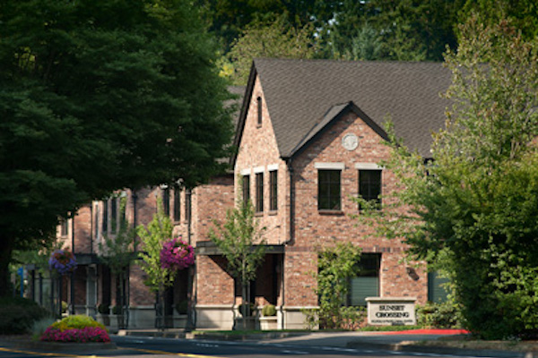 Brick building surrounded by trees. Brick building surrounded by trees.