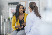 Woman consulting with doctor