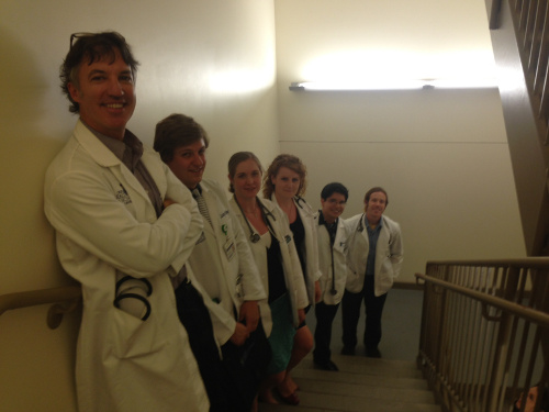 faculty and students in stairwell