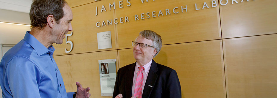 Dr. Brian Druker (left) and Dr. Gordon Mills talking at the 博彩网站 Knight Cancer Research building.