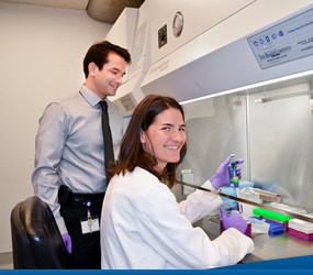 student and faculty conducting research