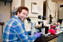 student at microscope