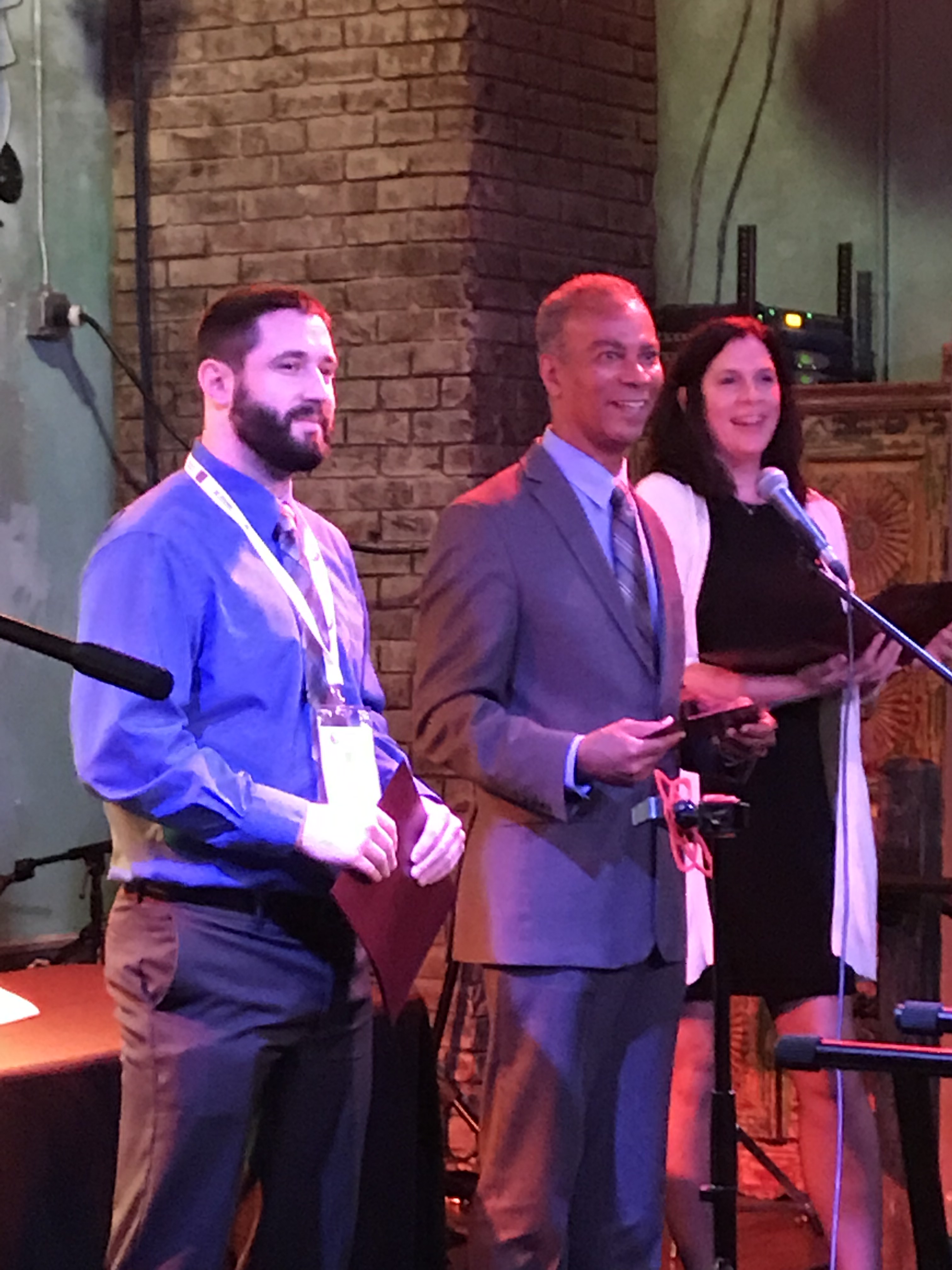 Ryan Cornelius stands on stage at the Experimental Biology Conference. 2019