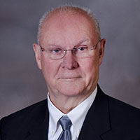 John Barry in professional attire