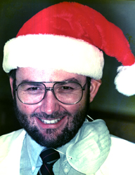 Les Morgan wearing a Santa hat