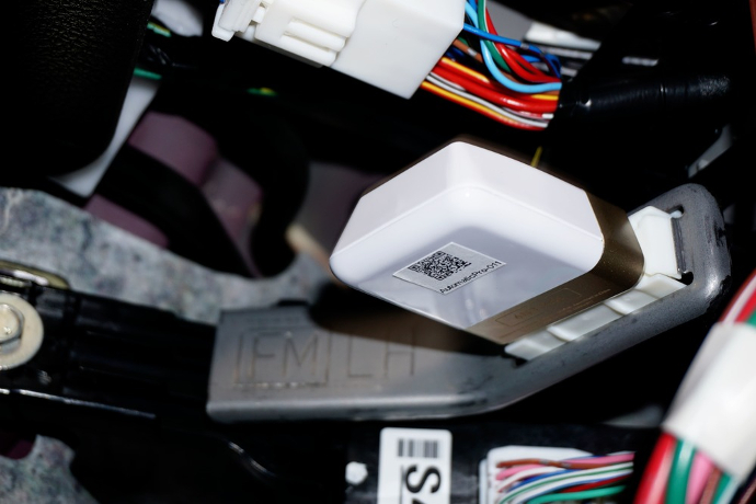 The car sensor, installed near the dashboard, measures how often a study participant drives.