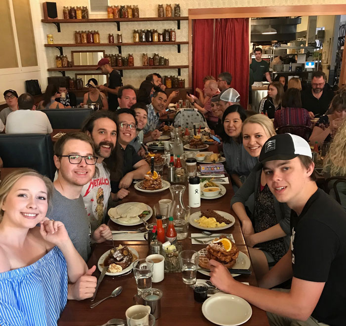 Lind Lab researchers sitting around a table at the Screen Door restaurant.