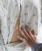 examining patient's spine