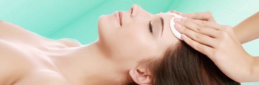 A relaxed woman receiving a facial