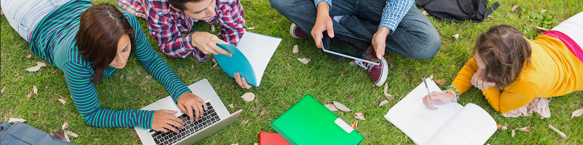 Photo of students outside studying.