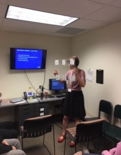 Woman holding communication system device
