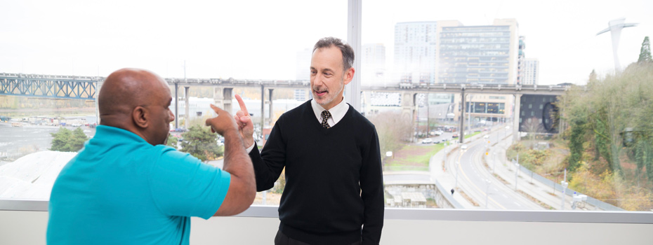 Dr. Jeffrey Kaye visiting with a patient in clinic