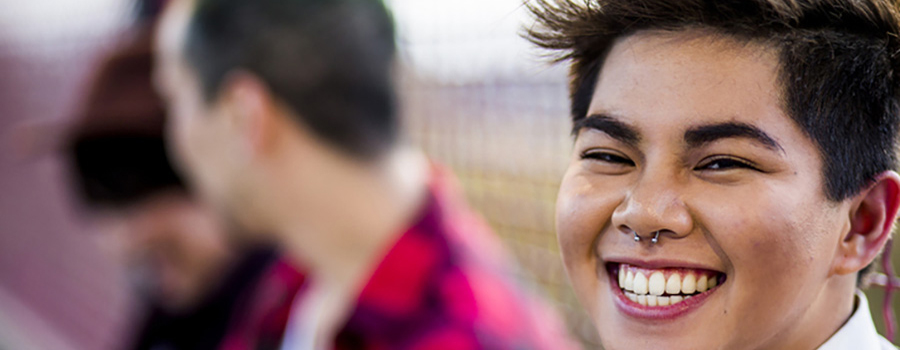 Photo of a person smiling at the camera.