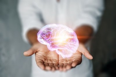 Two hands together with palms up with a picture of a brain in the hands
