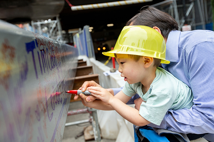 At the beam topping-off ceremony in May 2019, all were welcome to sign the building's highest beam.