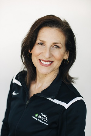 Anne Wallace with dark hair and dark jacket