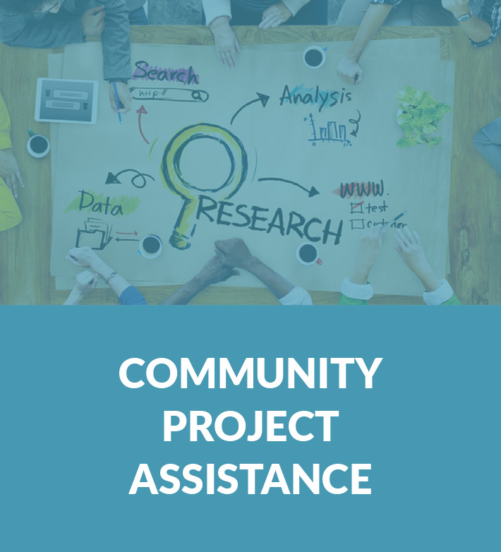 community project assistance with table working on research