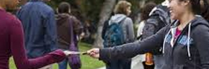 a woman passing out flyers