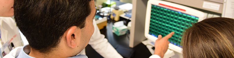 A group from the Kulkarni lab looks over research results on CTCs