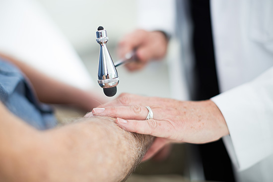 A doctor performing a full neurologic exam.