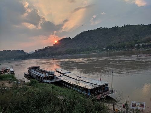 An image of a river at sunset in Laos.