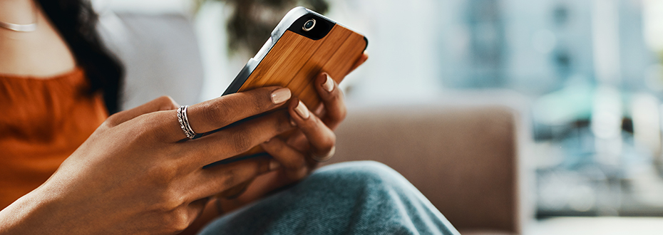 Woman's hands holding cell phone