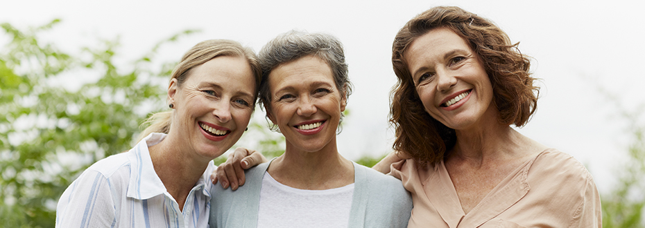 3 women walking outside together