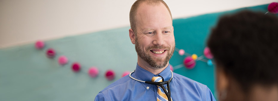 Dr. Brendan Kelly with a patient