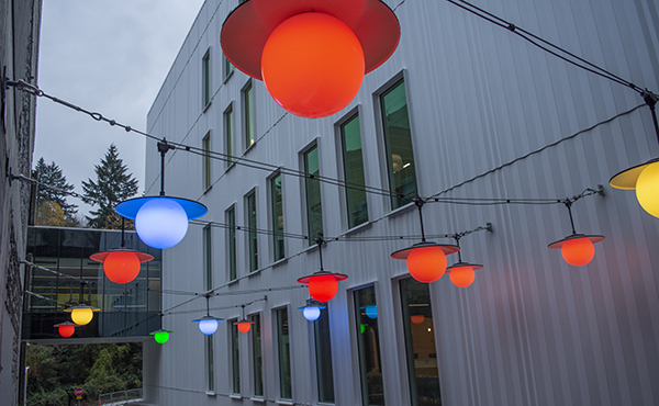 A view of the multicolored lights above the outdoor courtyard of the Elks Children's Eye Clinic building.