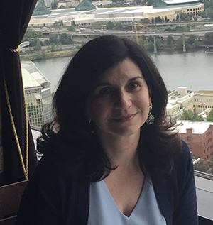 Alina Maloyan, Principal investigator of the Maloyan Lab sitting by a window