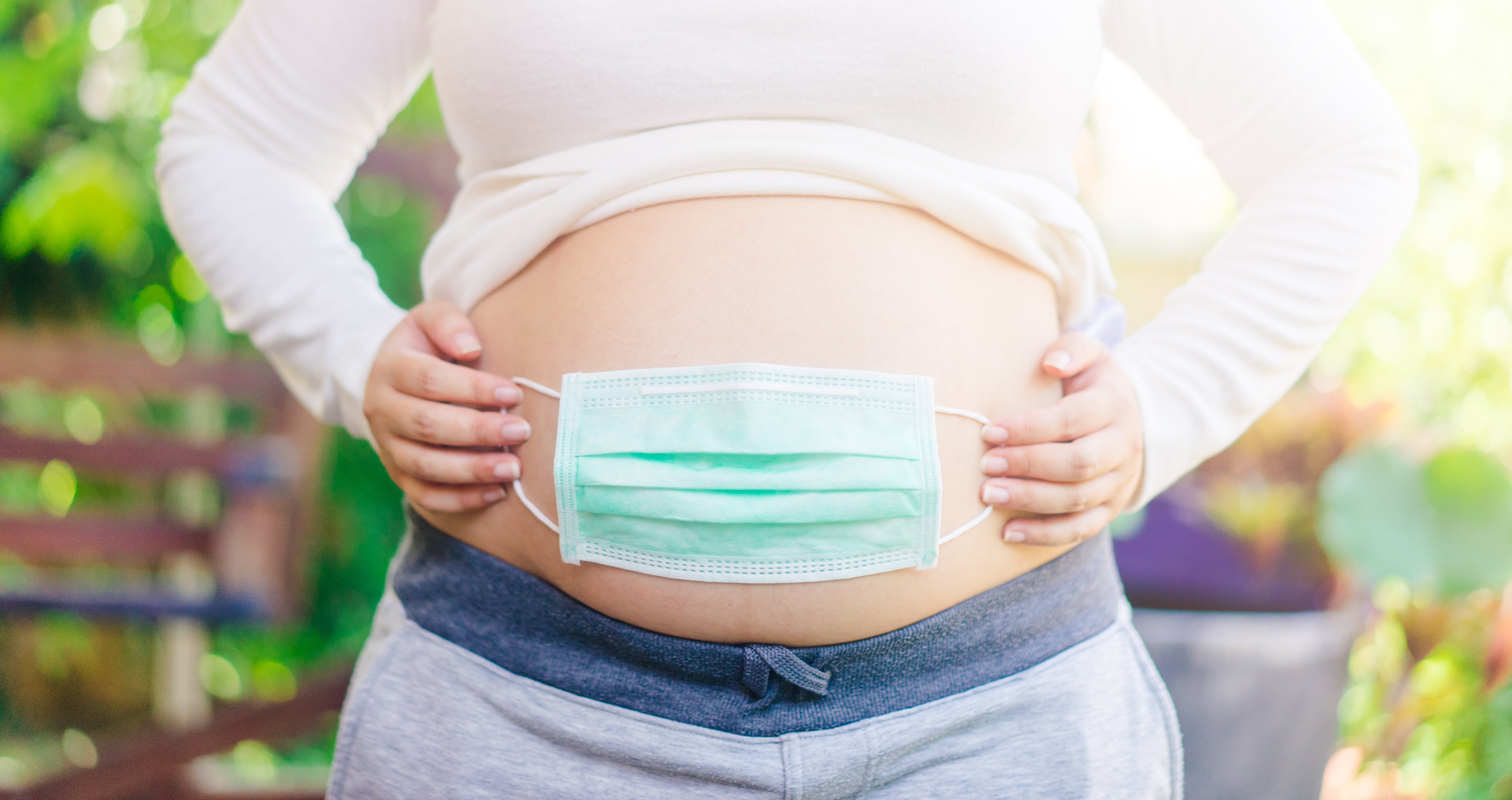 Pregnant belly with mask