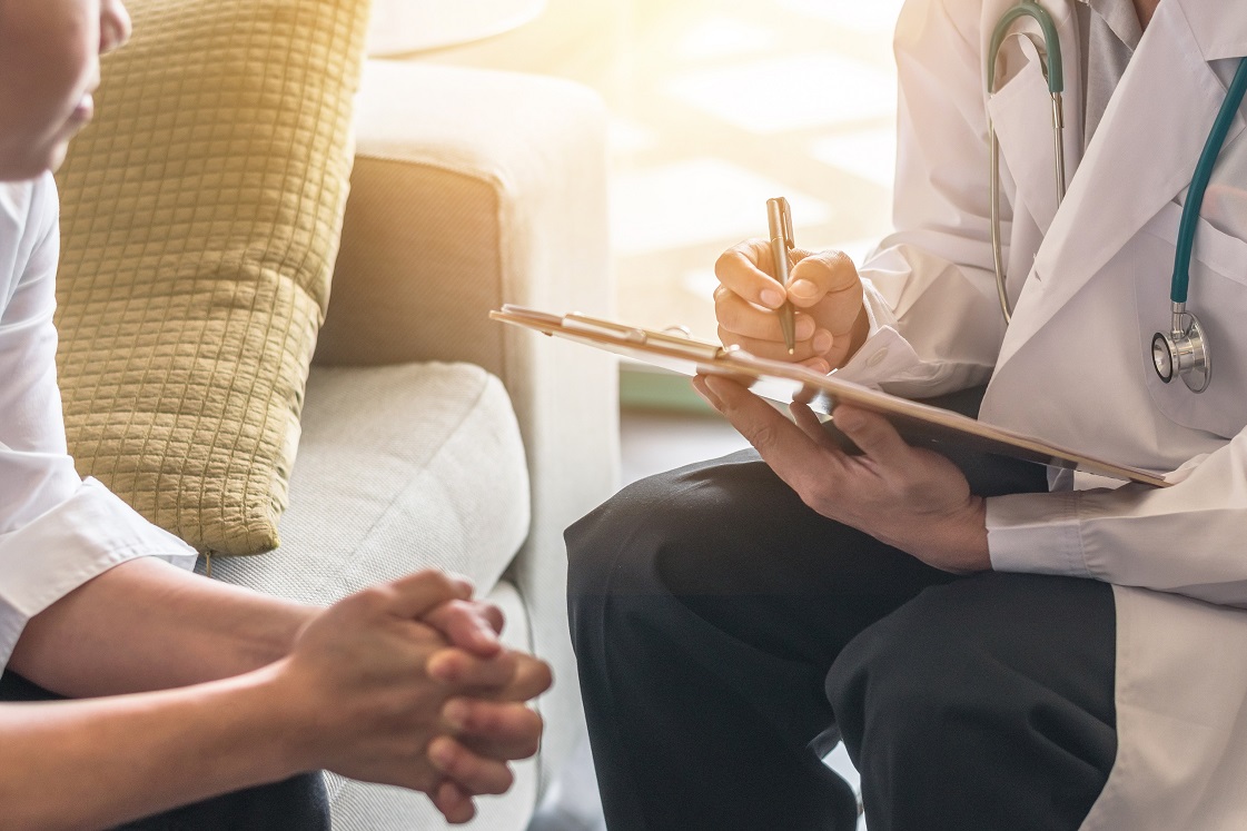 Patient and provider talking in a clinic setting
