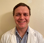 A professional photo of Dr. Andrew Gledhill.