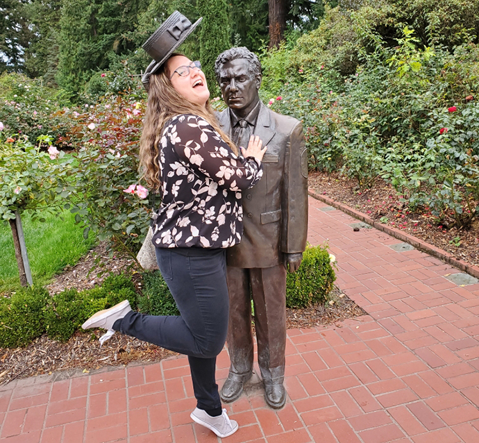 JoDee Hambright poses with a garden statue