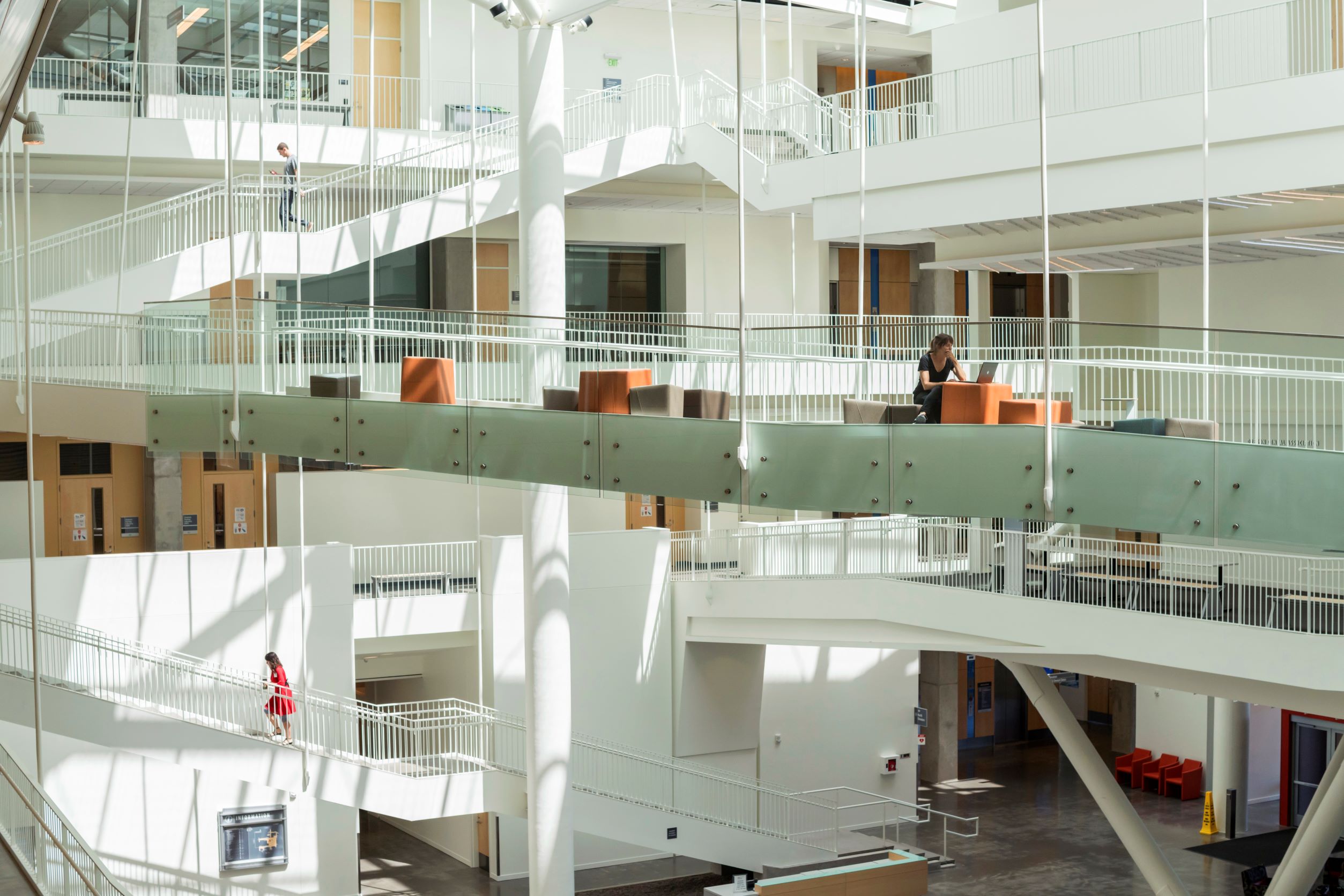 The interior of a building with various suspended walkways.
