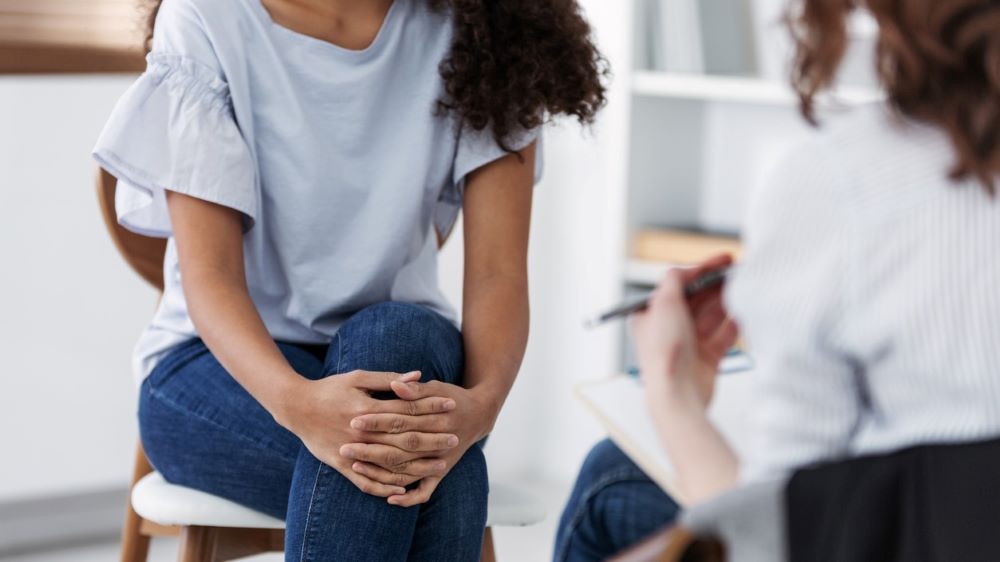 Provider and patient sit down to discuss something
