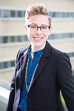 Outdoor photo of a smiling Doctor Holly Hinson