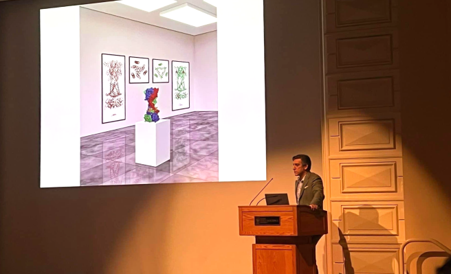 Steven Mansoor at a lectern presenting slides