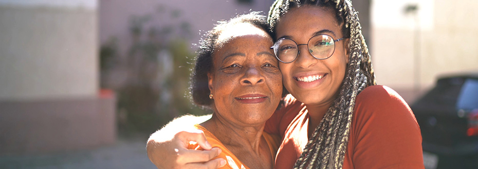 A mother and daughter smiling and embracing