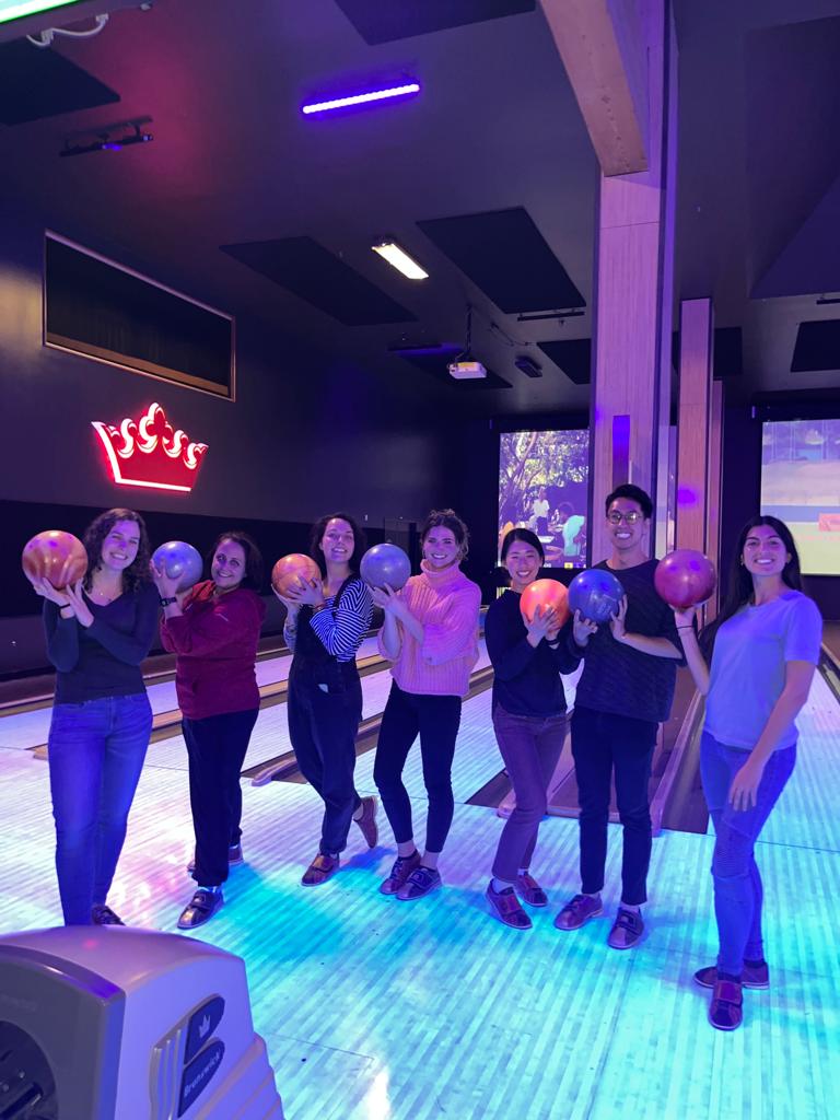 People standing together at a bowling alley