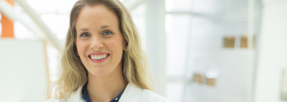 Photo of Dr. Andrea Stroud at 博彩网站 in white lab coat