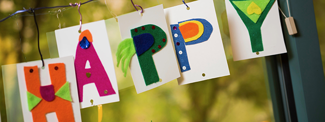 Photo of cards decorated to read "HAPPY."